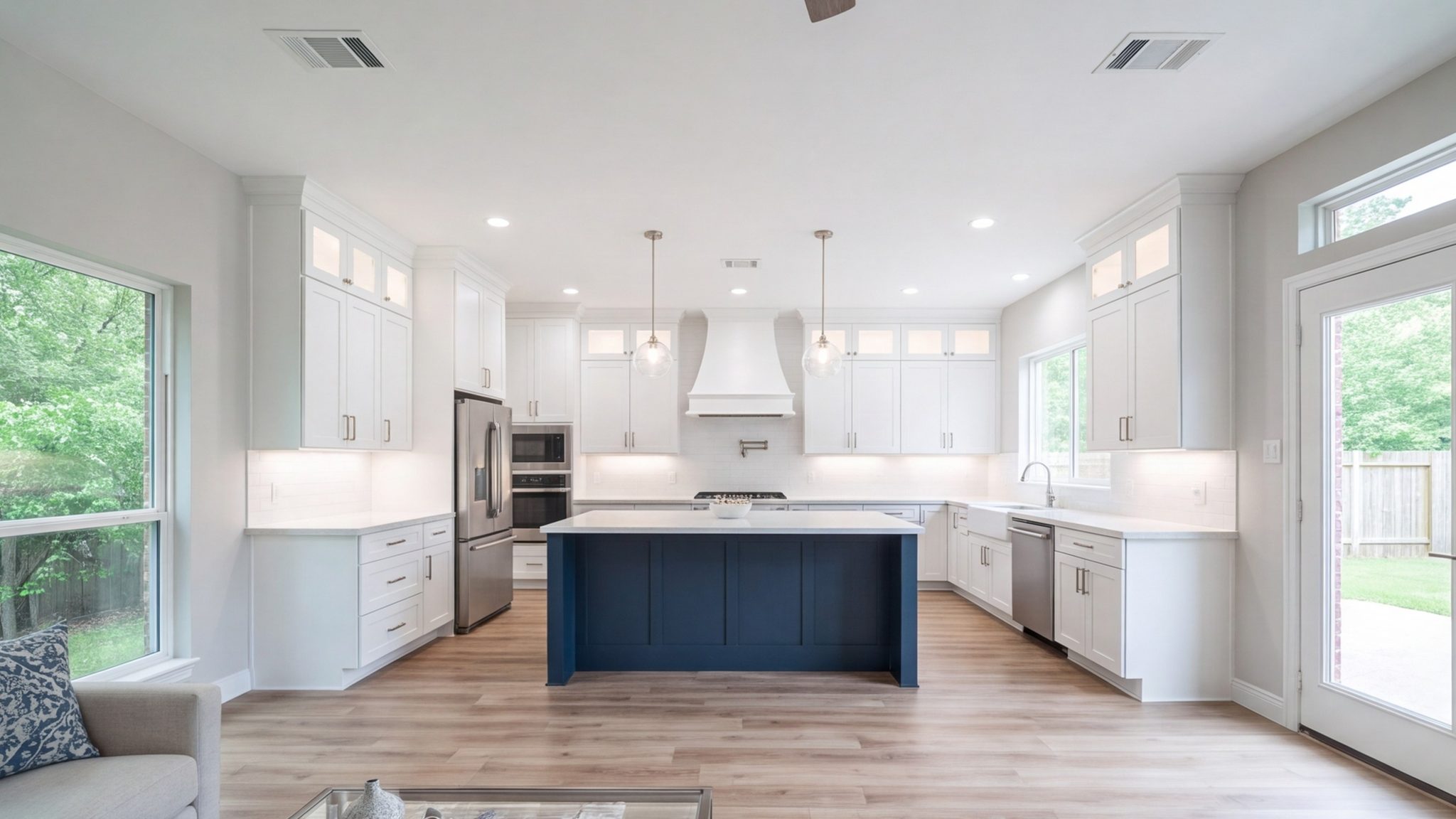 Finished modern kitchen with a large island, open to the living room